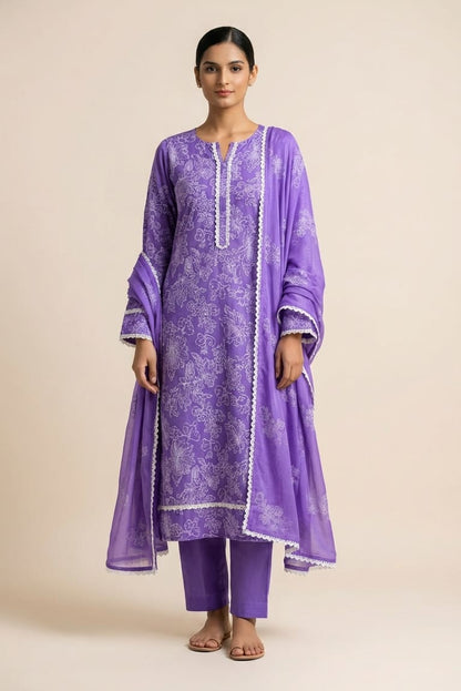 Woman wearing a purple traditional outfit with a beige background